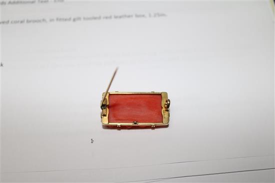 An 18ct gold mounted carved coral brooch, in fitted gilt tooled red leather box, 1.25in.